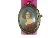 Antique Miniature Portrait Pin Women with Piercing Blue Eyes Stamped 800 Two-Tone Filigree Frame 12 Grams 1  1/2 Inches Wide 2 Inches Long