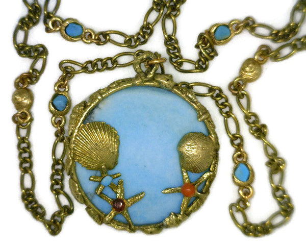 Turquoise Medallion Set in 7 Karat Yellow Gold 43 mm Round Seascape Bezel features Sea Horses Sea Shells Star Fish Suspends on Figaro Style and Sea Shell Links Chain 14 Dwt 24 Inches Long